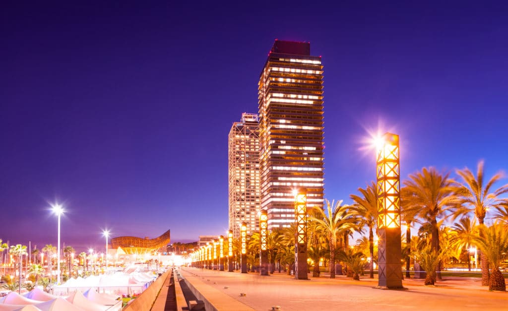 night view of skyscrapers in Port Olimpic - center of nightlife at Barcelona