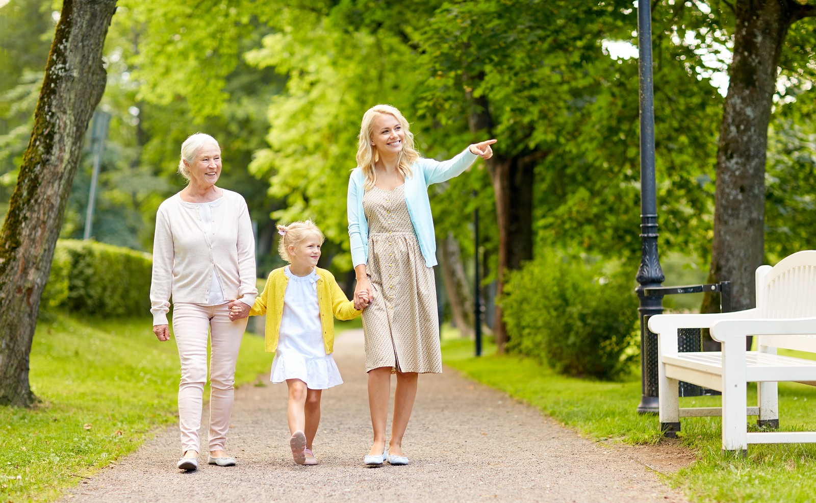 Mother, grandmother, and daughter walking